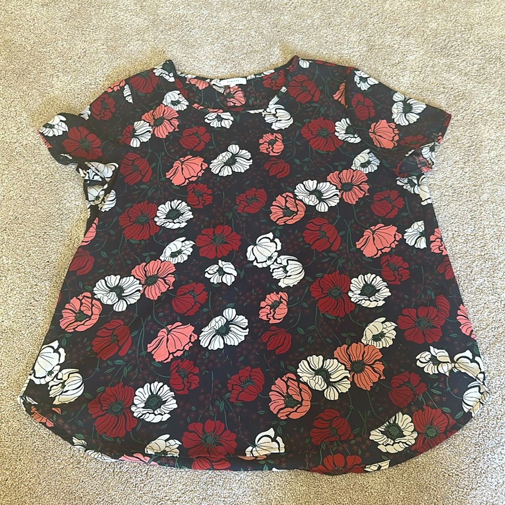 Short sleeve work blouse. Black with tan, pink, and red flowers.